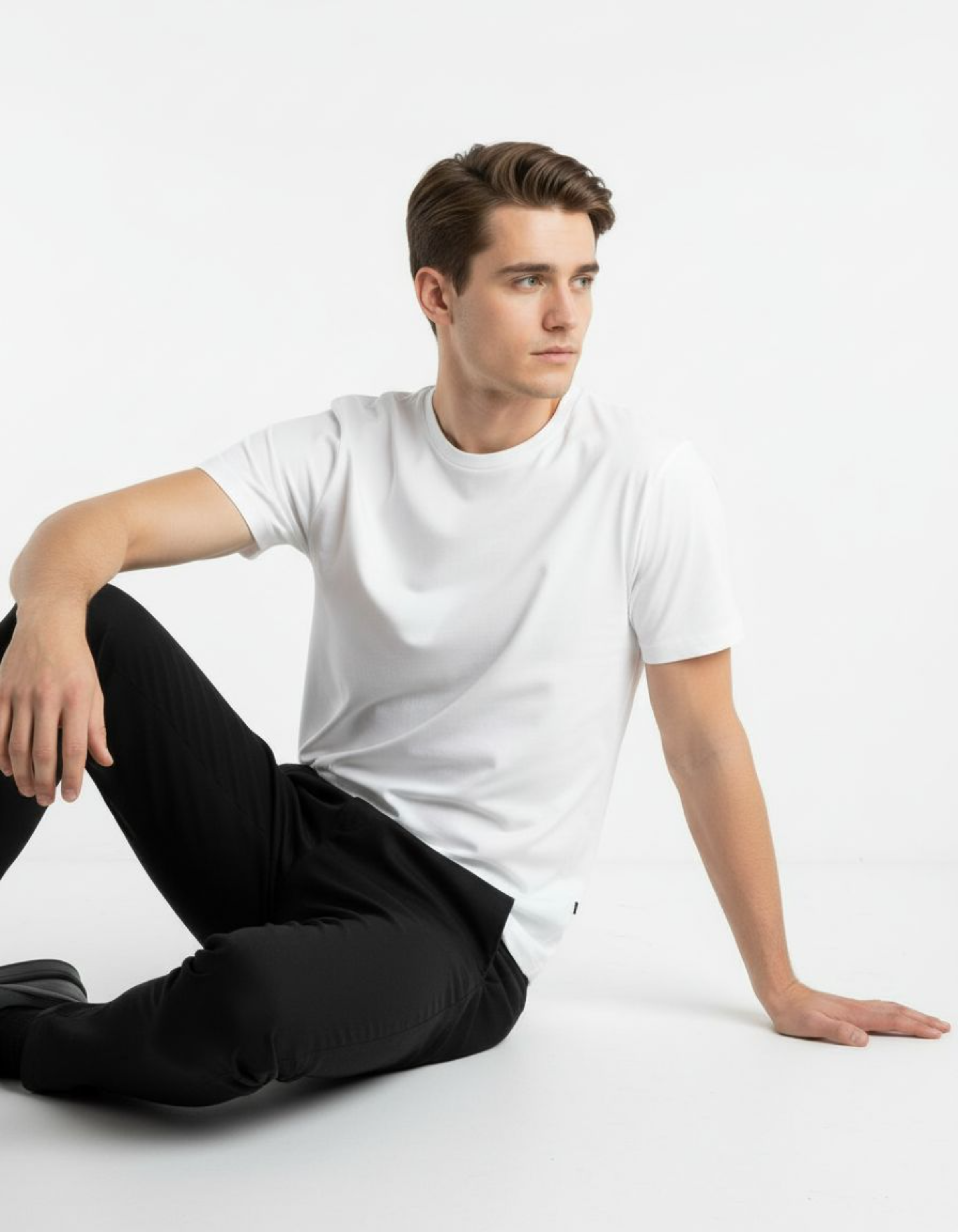 Man wearing a white t-shirt against a plain background