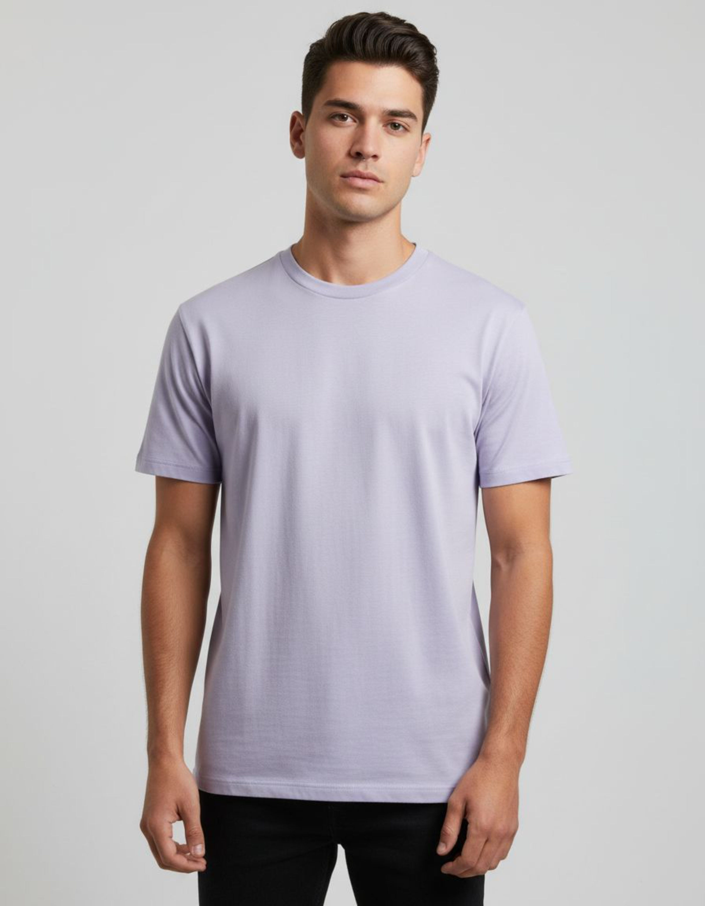 Man wearing a lavender t-shirt against a plain background